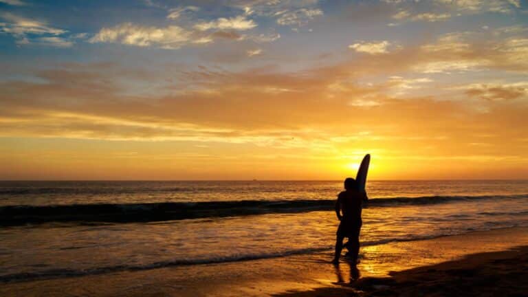 A surfer at one of Kauai's best surf spots