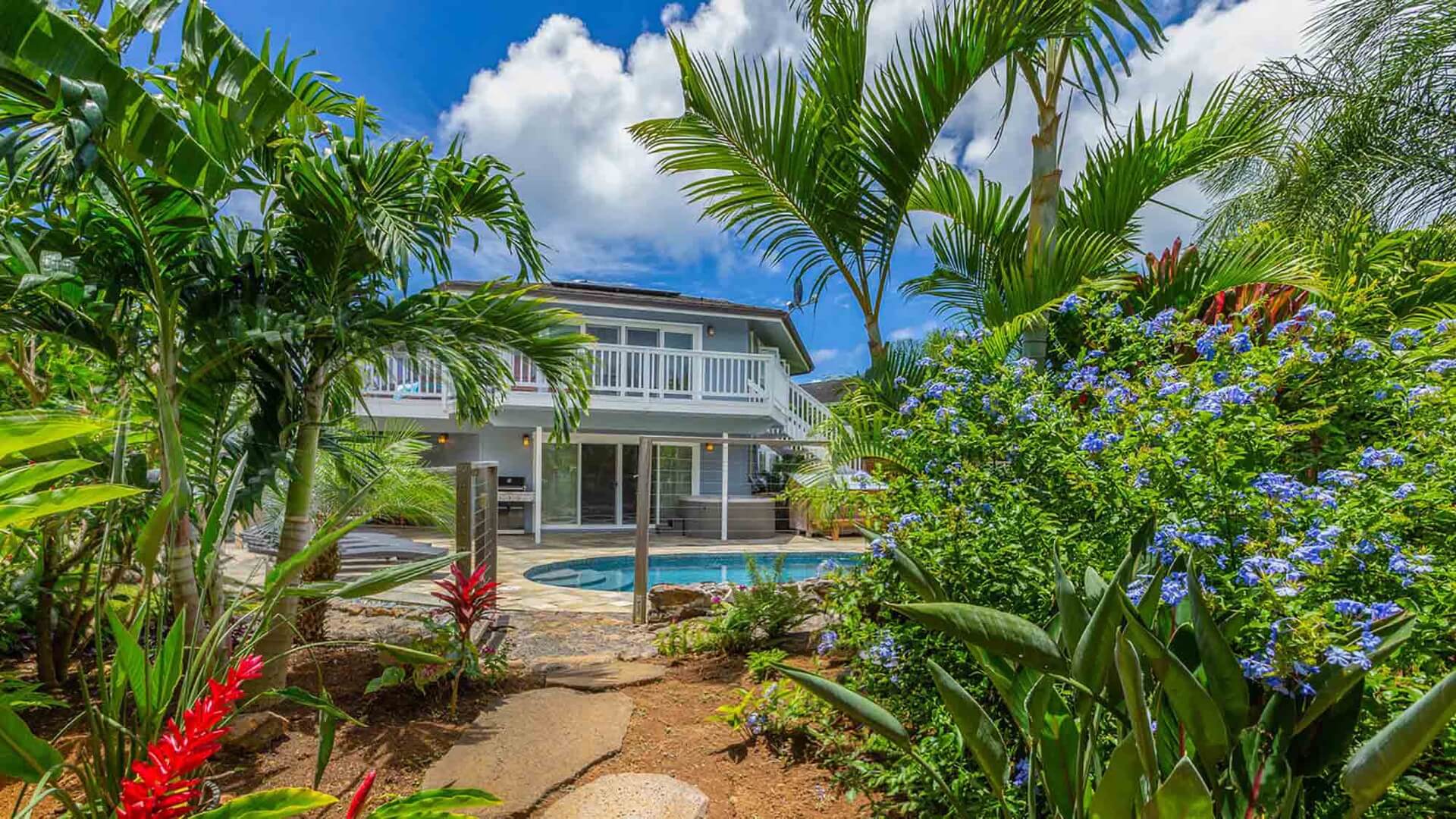 The exterior and pool deck of The Oasis at Princeville, a vacation home rental on Kauai's North Shore