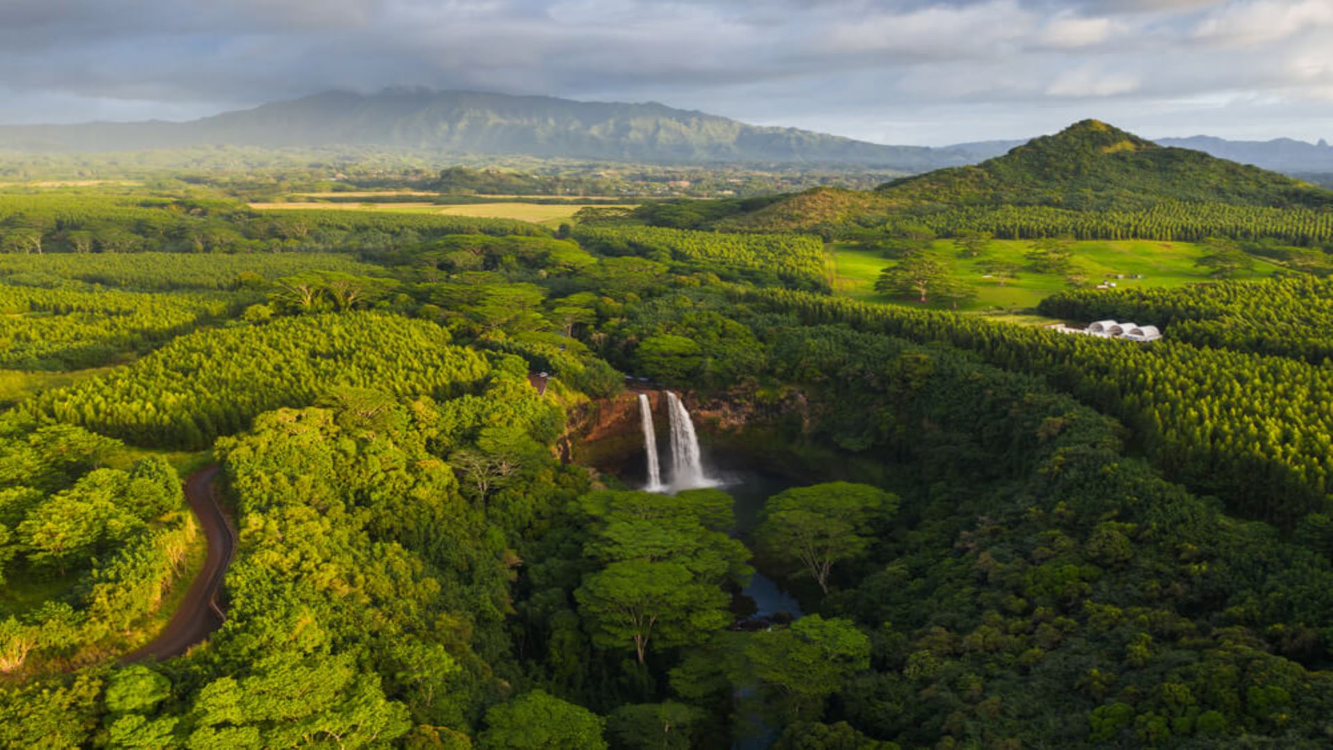 A waterfall in Kauai, a summer bucket list item for many