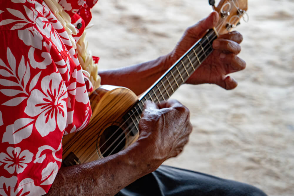 A man playing live ukulele music on Kauai
