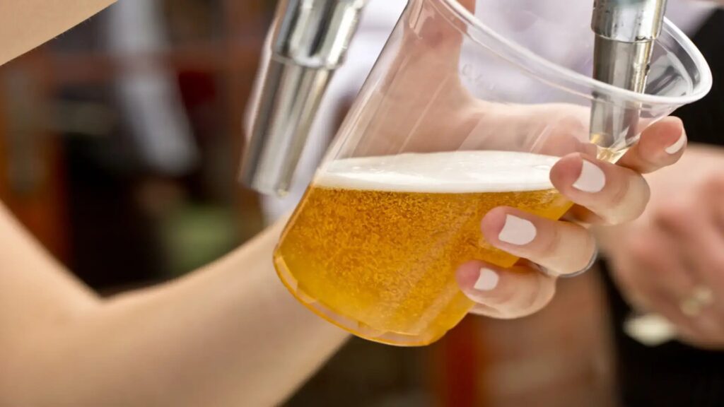 A bartender pouring beer at the Kauai Brewers Festival