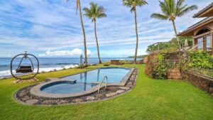 The oceanfront pool at Paradisio Hoo Kumu, a vacation home on Kauai