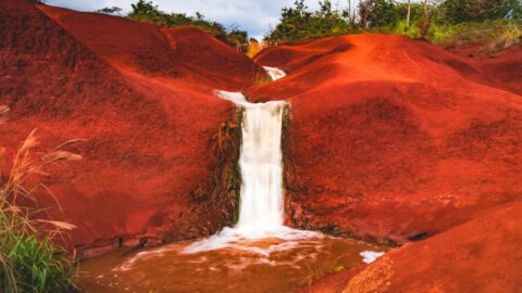Water cascading down Red Dirt Falls in Kauai