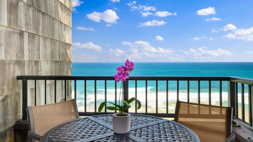 A beautiful ocean view from a covered lanai at one of Parrish Kauai's condo rentals