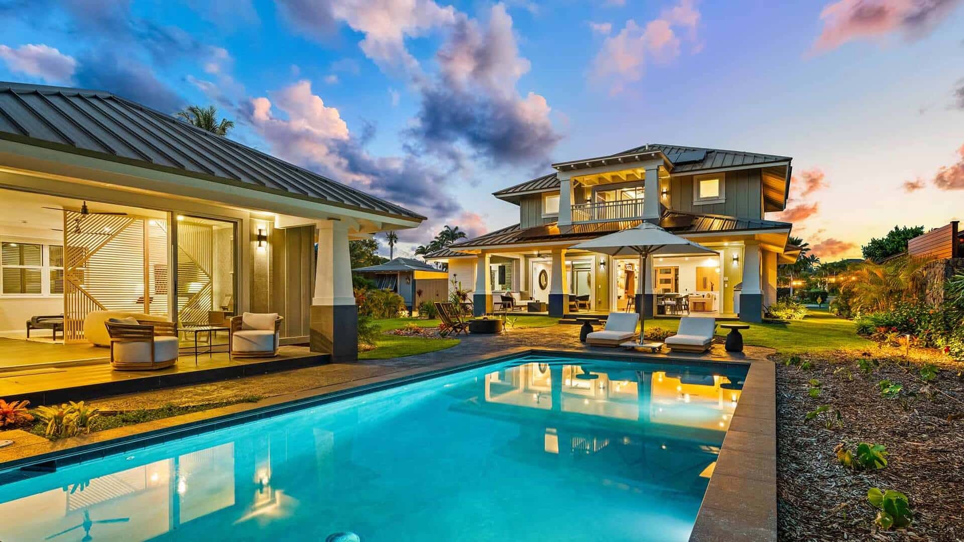 A view of the pool, lanai, and outdoor living space at Kukuiula Makai Cottage #33