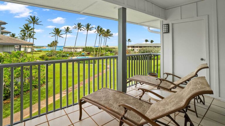 Ocean and garden views from the covered lanai at Poipu Sands at Poipu Kai #126
