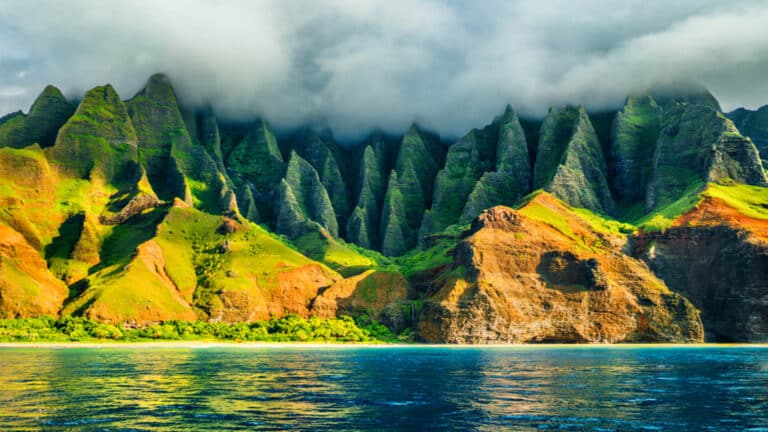 The lush Na Pali Coast with clouds hanging over top