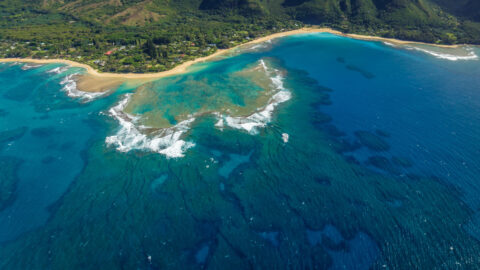 An aerial view of the coral reef off of Anini Beach in Kauai, Hawaii's longest reef