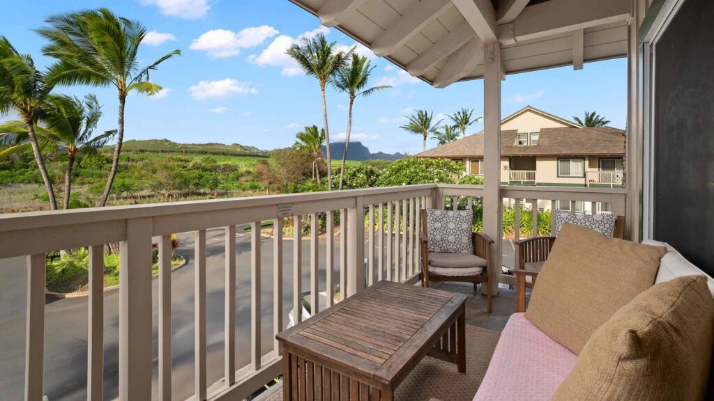 Garden and mountain views from the covered lanai at Regency at Poipu Kai #123